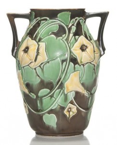 The Monsen-Baer Collection included many experimental pieces made at the factory. This Morning Glory glaze trial vase in a double-handle amphora shape has yellow blossoms on one side and white blue tinted blossoms on the reverse – final price $2,100 (est. $400-$600). Humler & Nolan image